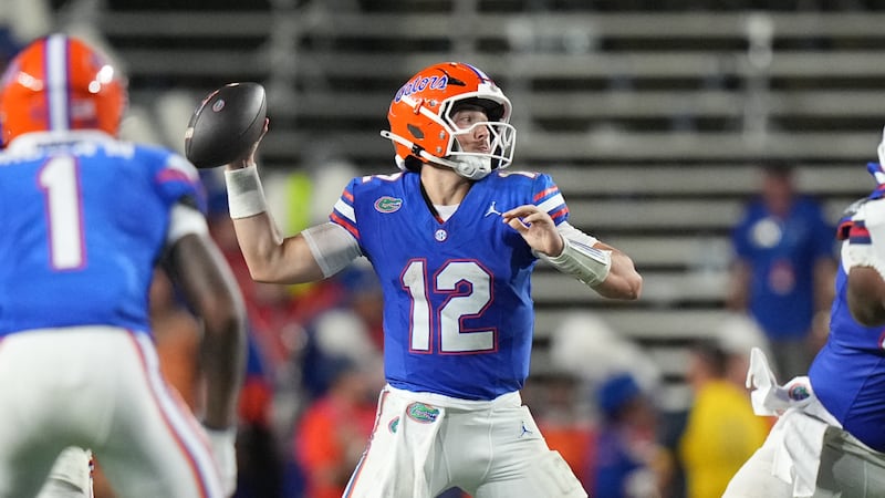Florida Gators quarterback Aaron Philo (12) makes a pass attempt in the first half during an...
