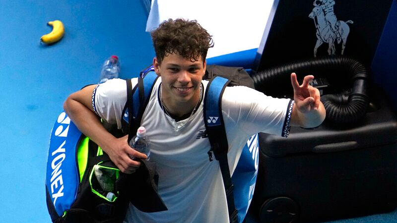 Ben Shelton of the U.S. waves as he leaves Rod Laver Arena following his quarterfinal loss to...