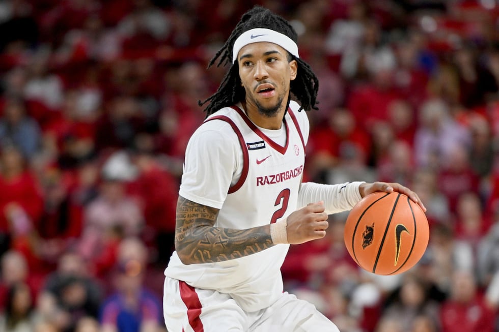 FILE - Arkansas guard Boogie Fland (2) runs a play against Florida during an NCAA college...