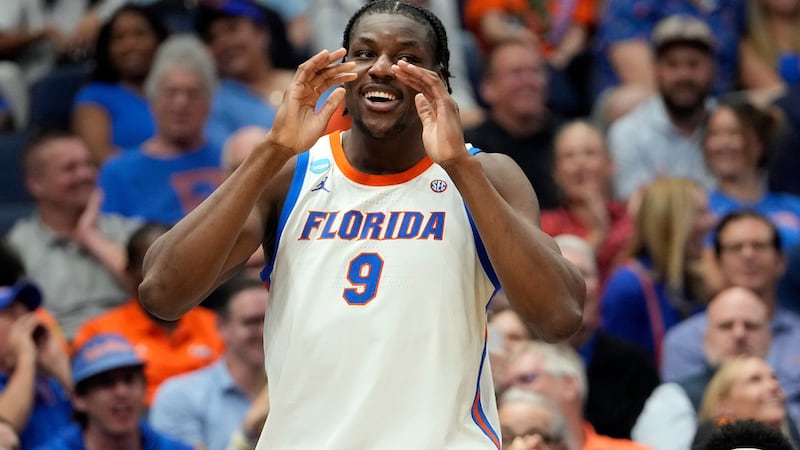 Florida center Rueben Chinyelu (9) celebrates during the second half in the first round of the...