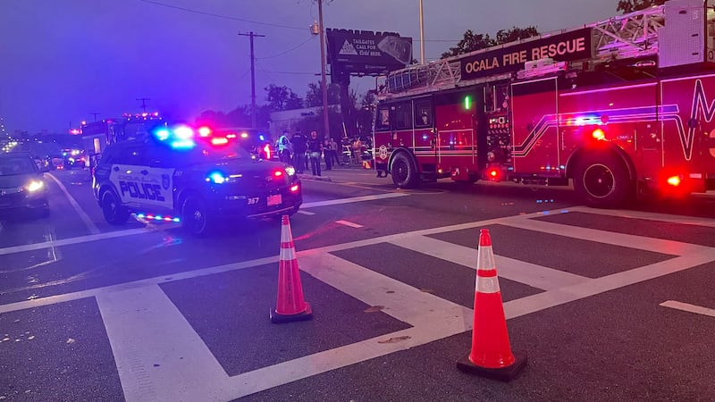 There is a crash involving a pedestrian at the intersection of S Pine Ave and SW 10th St.