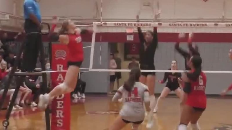Santa Fe's Taylor Sembower hits a kill against Orangewood Christian.